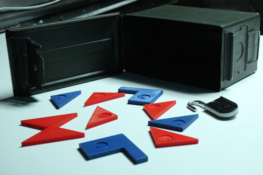 Escape room puzzle elements with a lock and colorful shapes, set for a challenging game.