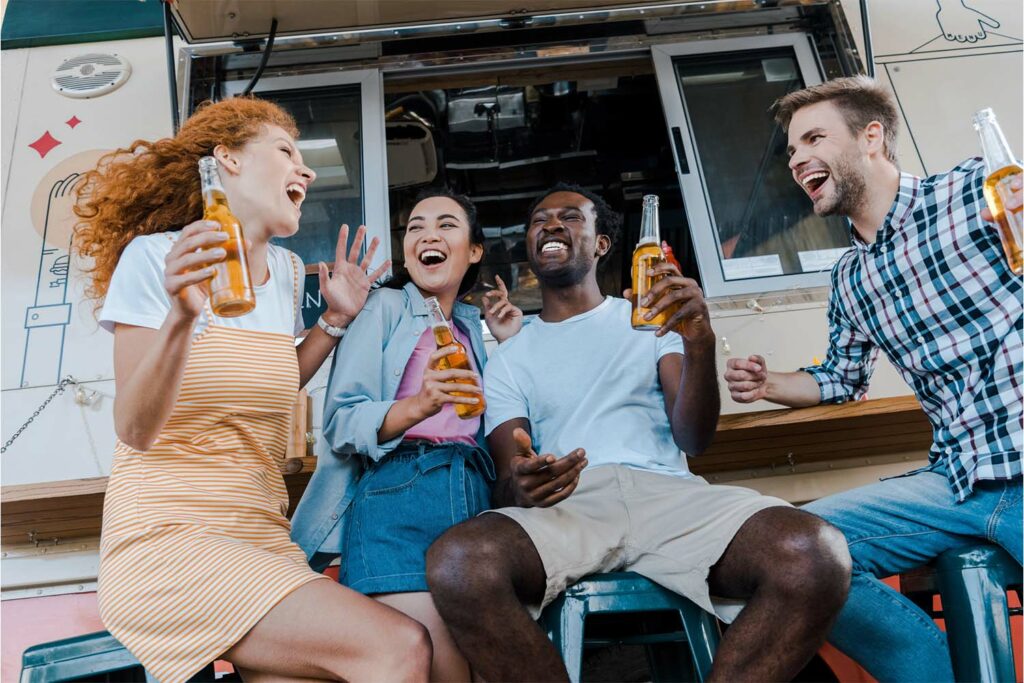 Friends laughing and having fun during a unique bachelor or bachelorette celebration in Calgary.