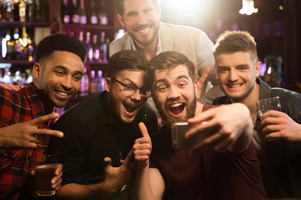 Friends taking a selfie during a bachelor party