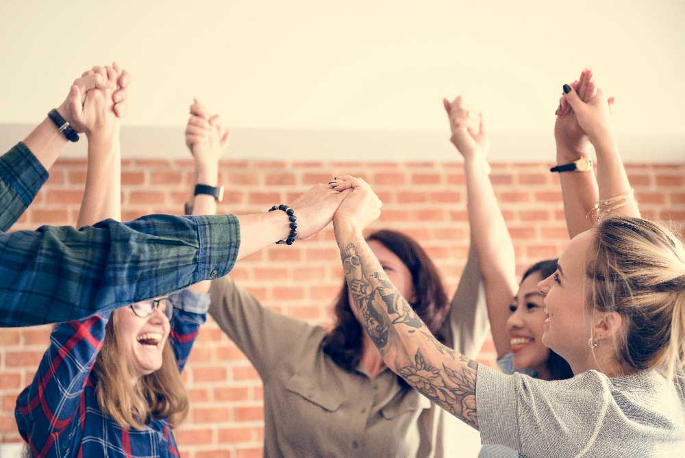 Team celebrating together during a corporate group activity