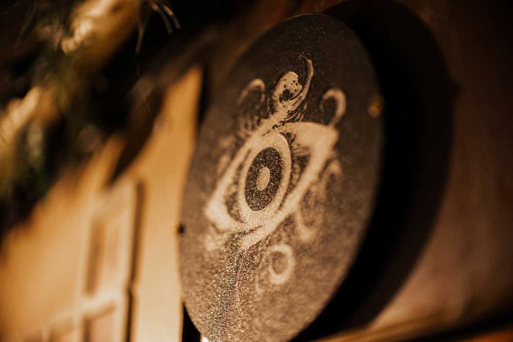 Close-up of a mysterious eye symbol prop in the Eldritch Emporium escape room