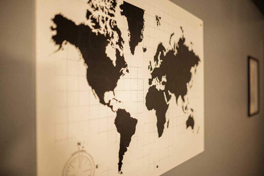 World map wall art inside the Ops Cognition escape room