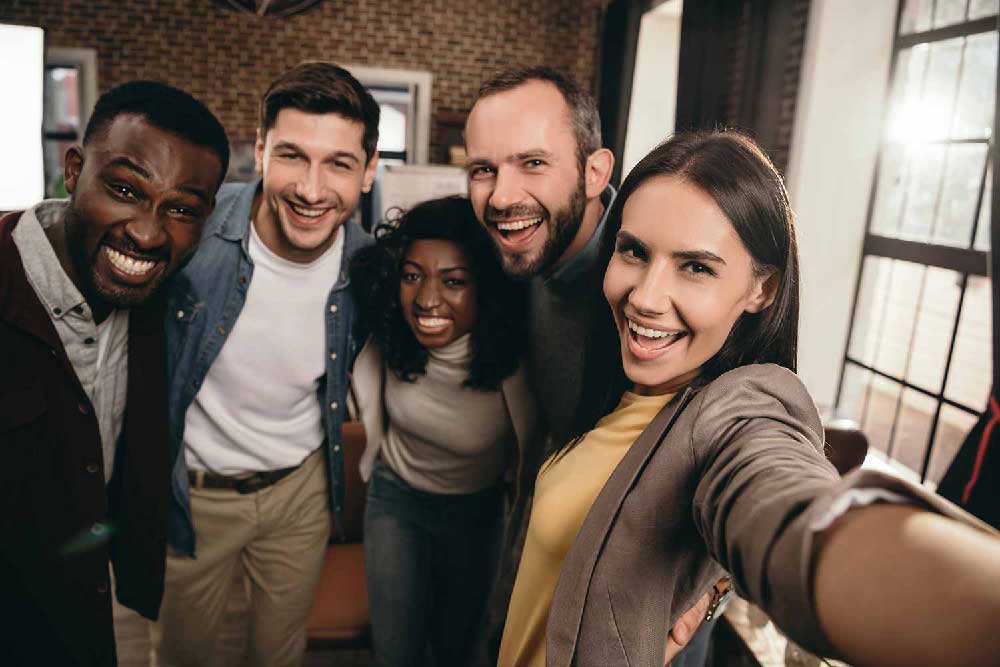 Group posing together during a team building activity